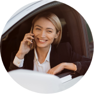 woman-talking-on-smartphone-and-charging-car-on-ev-2023-11-27-04-51-27-utc